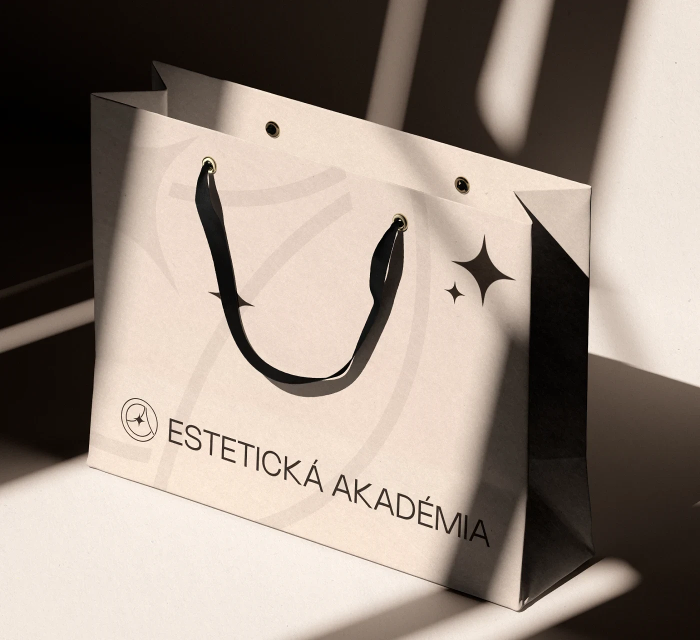 Estetická Akadémia branded paper bag and seal tag.