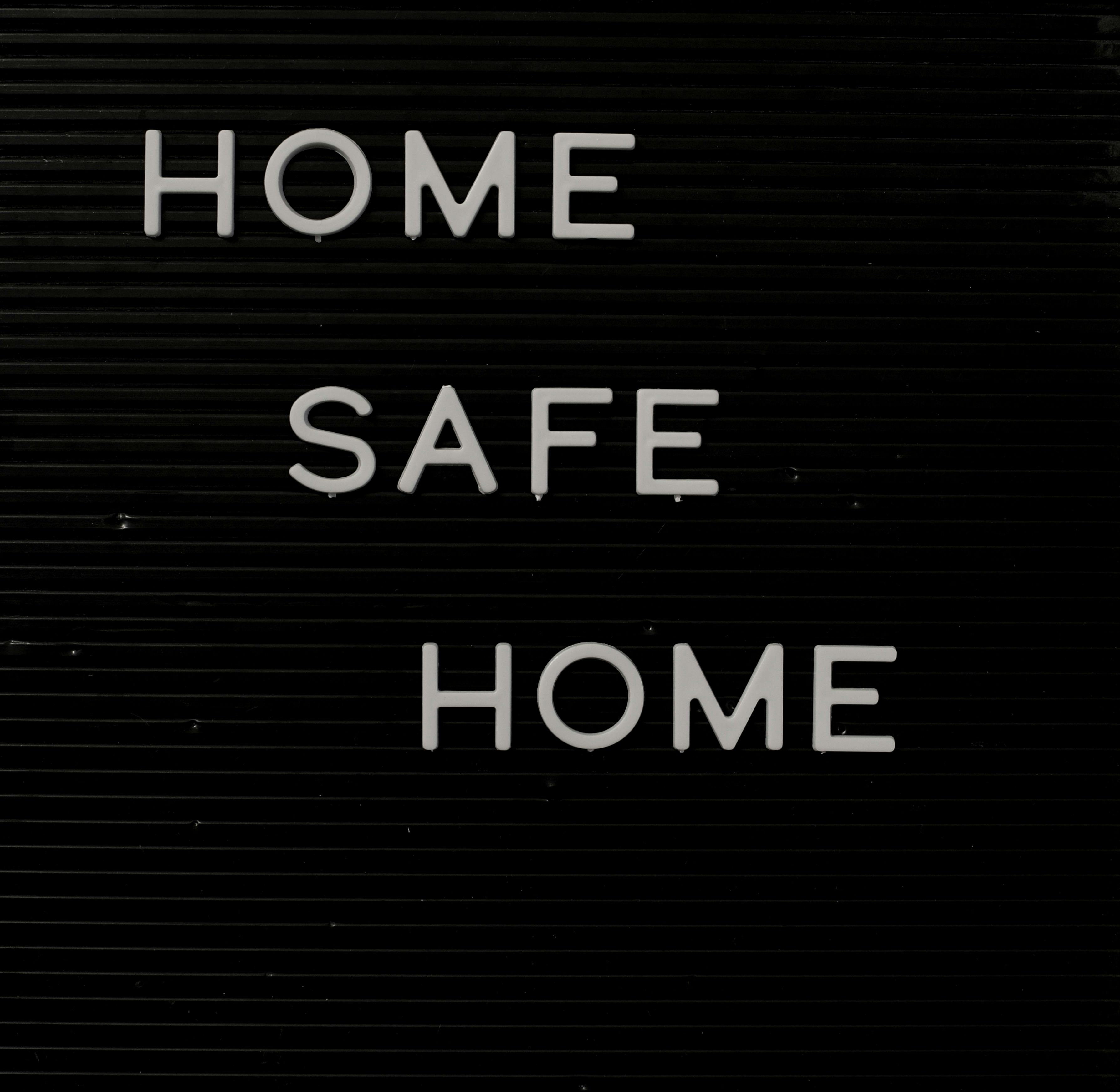 Home Safe Home sign on a letter board reflecting safety and coziness.