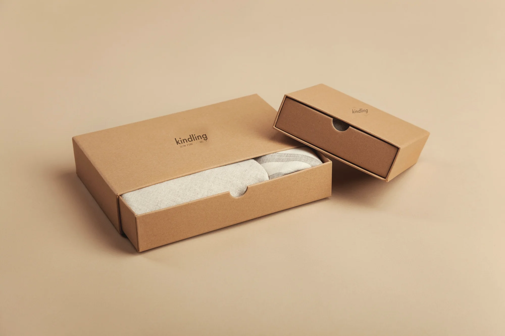 Kraft slide box with the Kindling wordmark