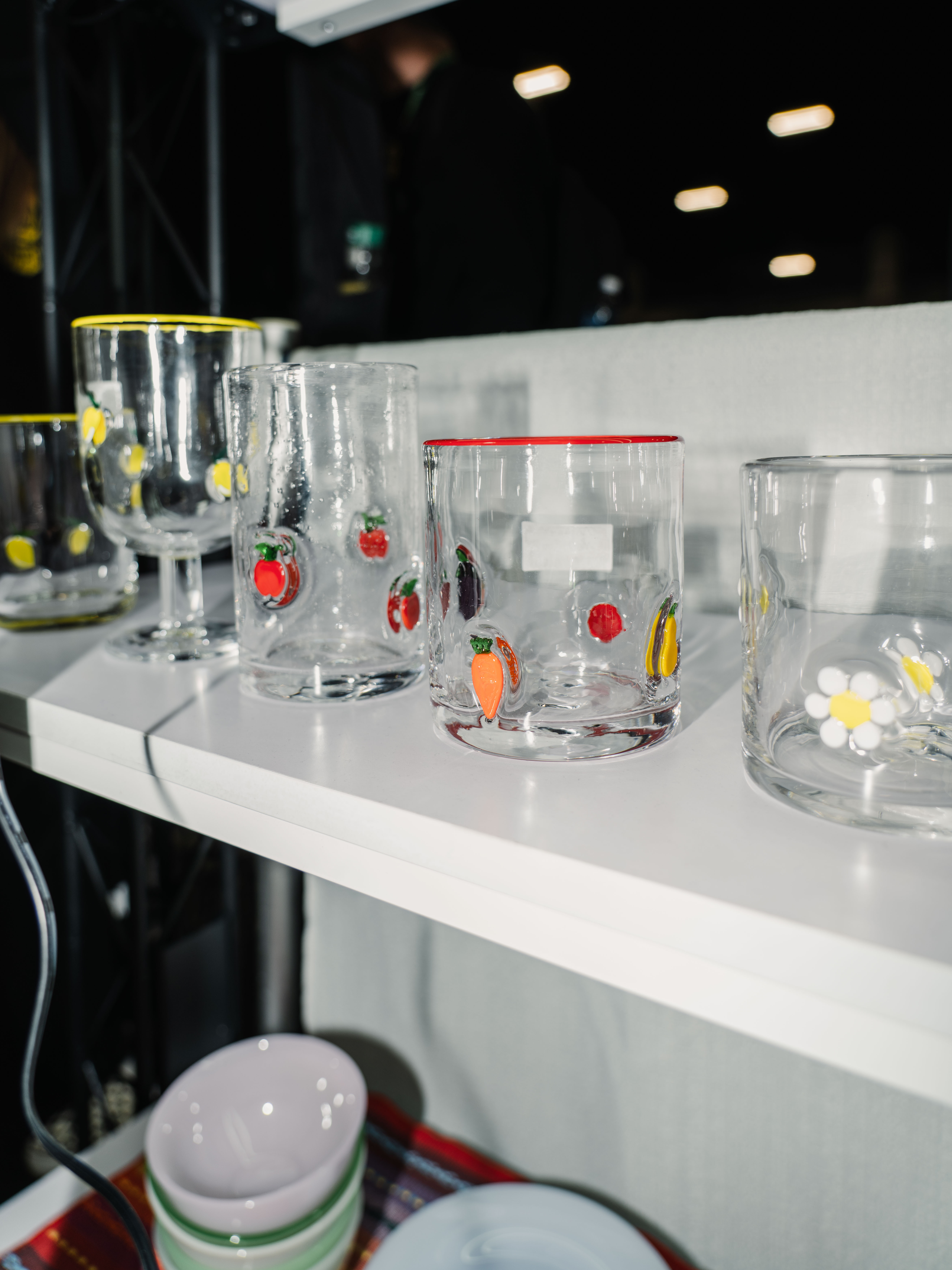 Handmade looking glass cups with glass charm details inlaid in the glass.