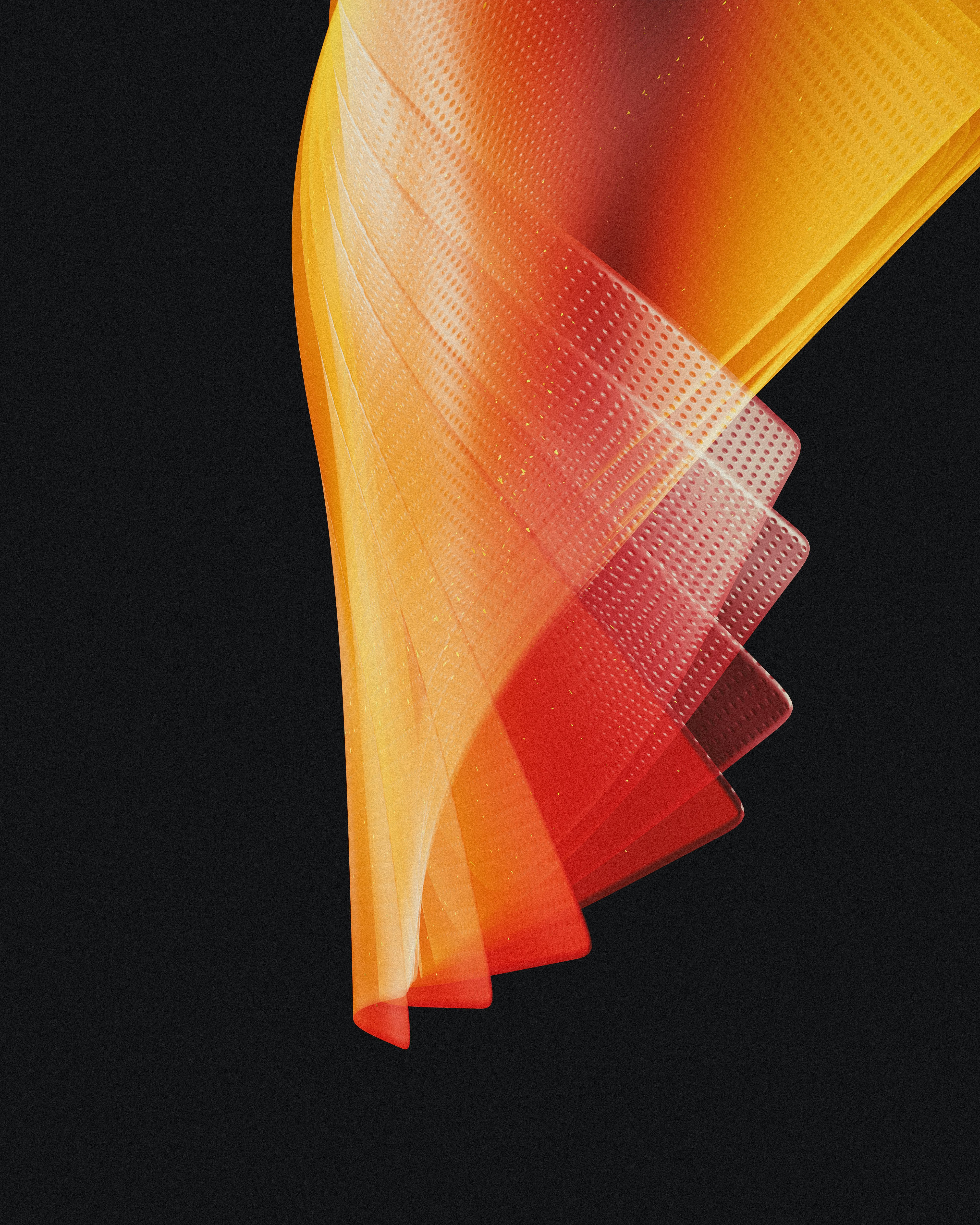 a close up of a red and yellow object on a black background