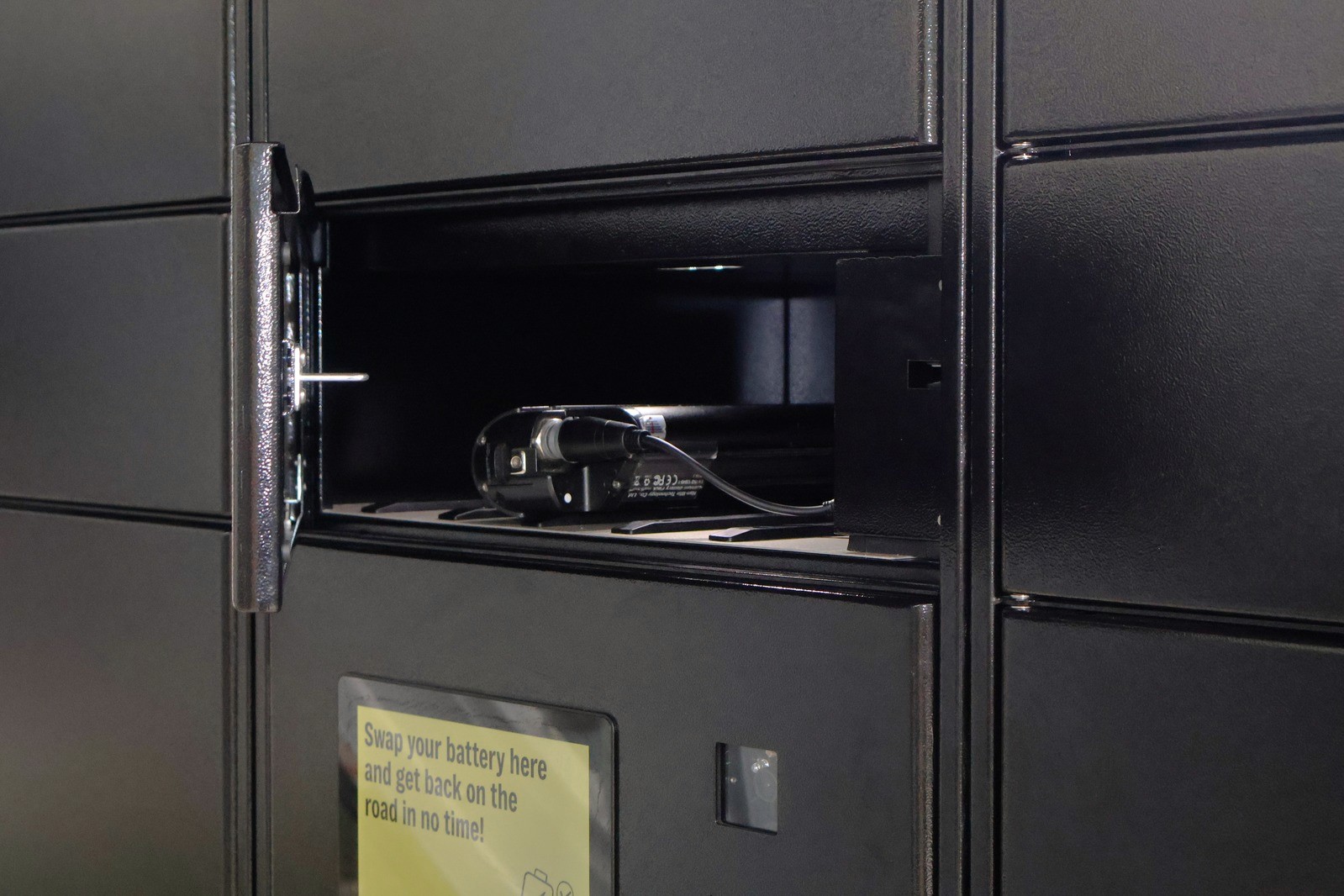 Open SmartSwapping locker with e-bike battery ready for a swap, Berlin.