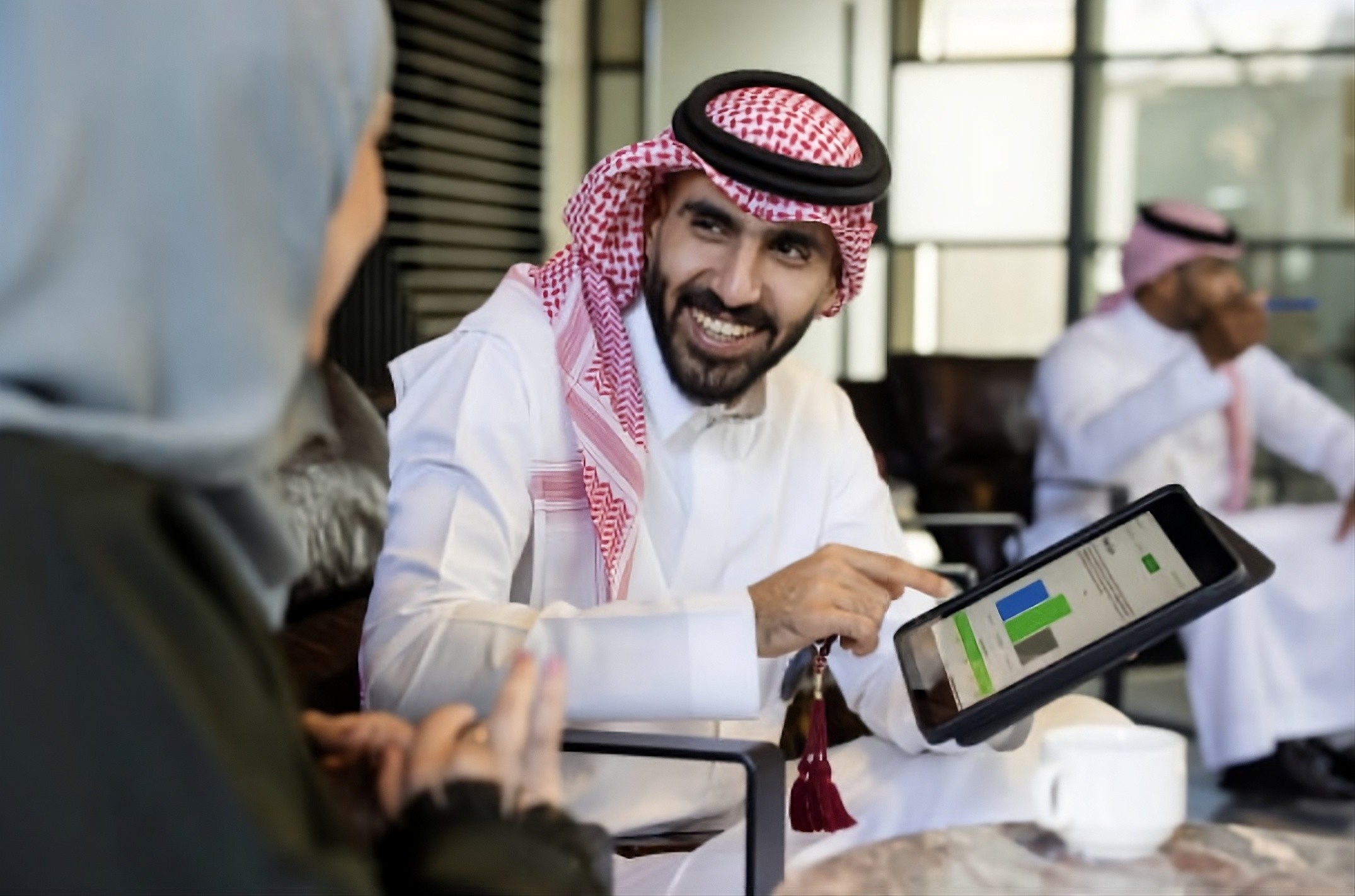 man sitting beside woman looking at a contract on DocuSign