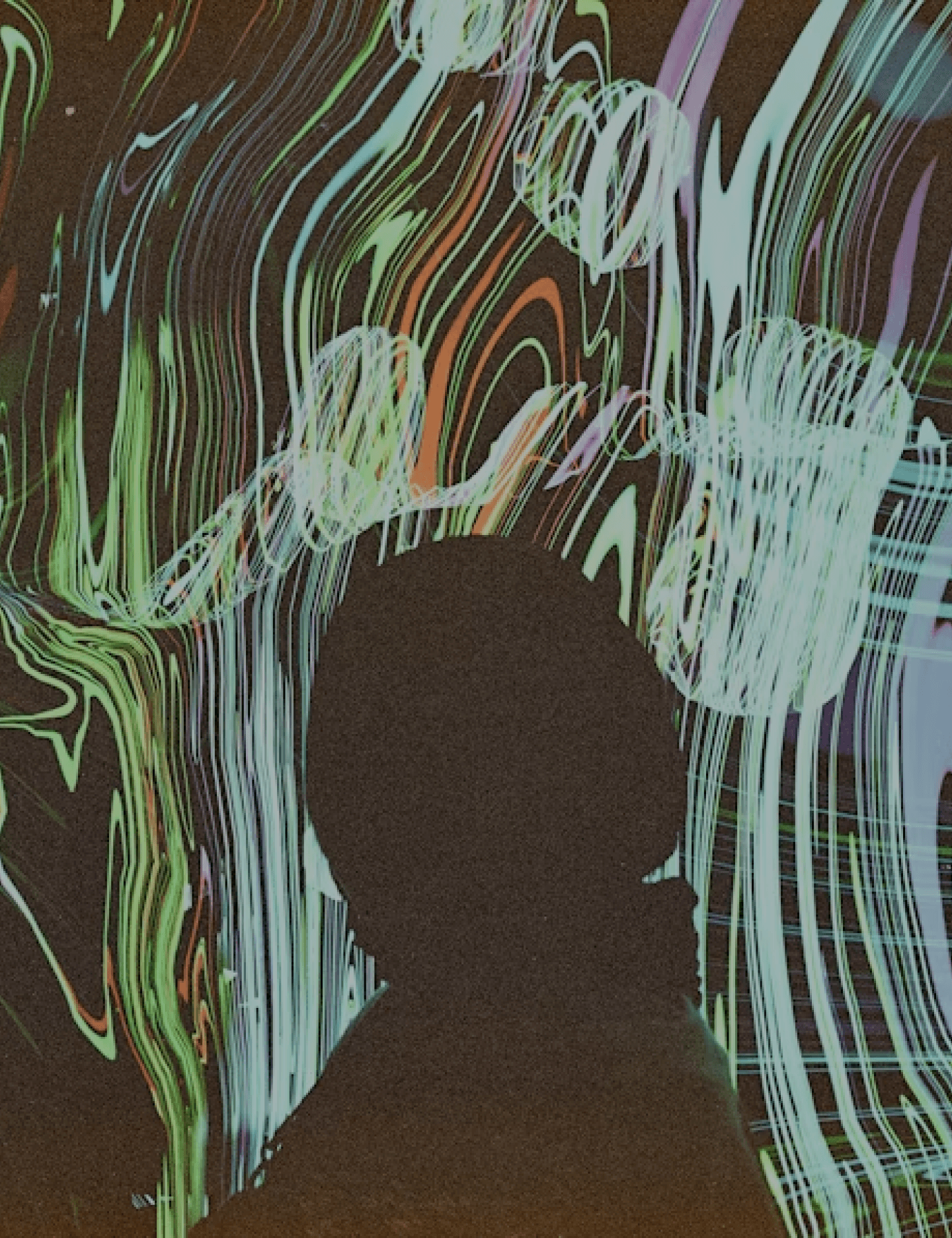 Silhouette of a person standing in front of colorful, flowing abstract light patterns.