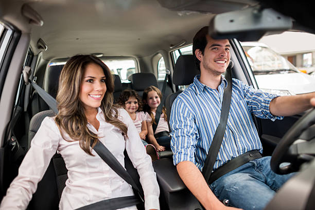 Family in a car, representing vehicle insurance coverage from We Insure Downtown Miami.