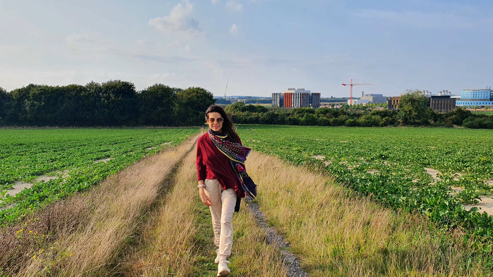 Samira sitting in Dover with the white cliffs in background