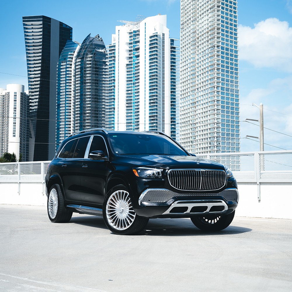Front 3/4 view of a black Mercedes-Maybach GLS 600 rental in Miami, showcasing its majestic grille and imposing presence.