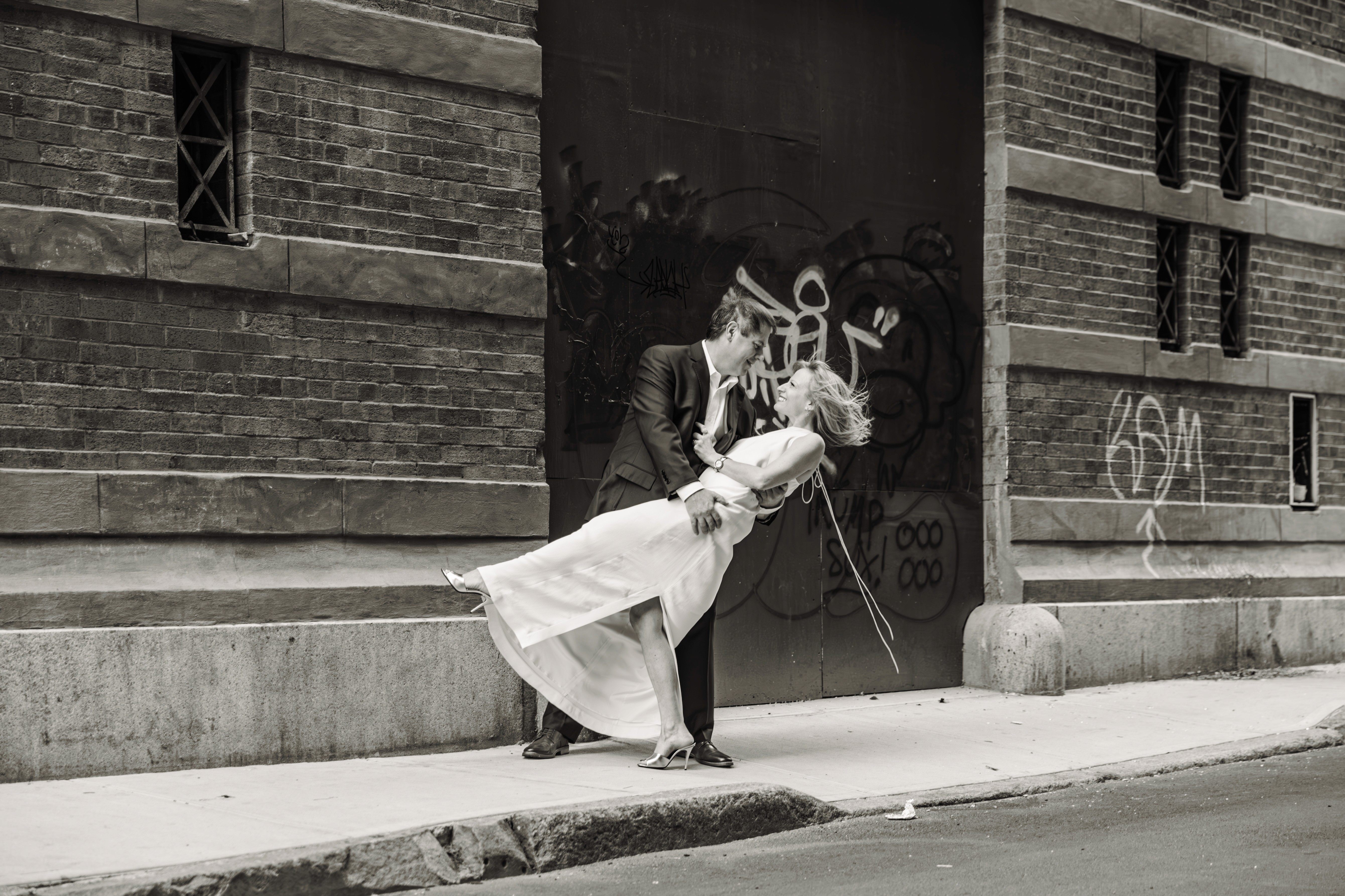4:59 PMCouple caught in a genuine laugh on the stairs at Bethesda Fountain in Central Park, NYC — fun, unposed couples photography by Lizz Spano Photography, New York City couples photographer.