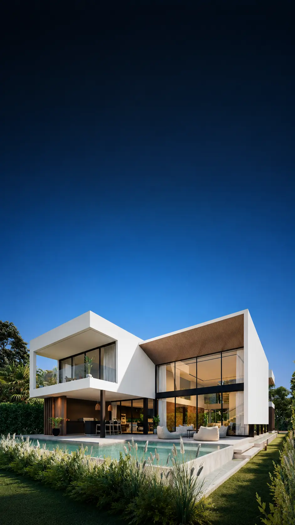 Modern two-story custom home in The Roads at dusk, with a cantilevered upper volume, floor-to-ceiling glass, open-air living space, pool, and landscaped garden.