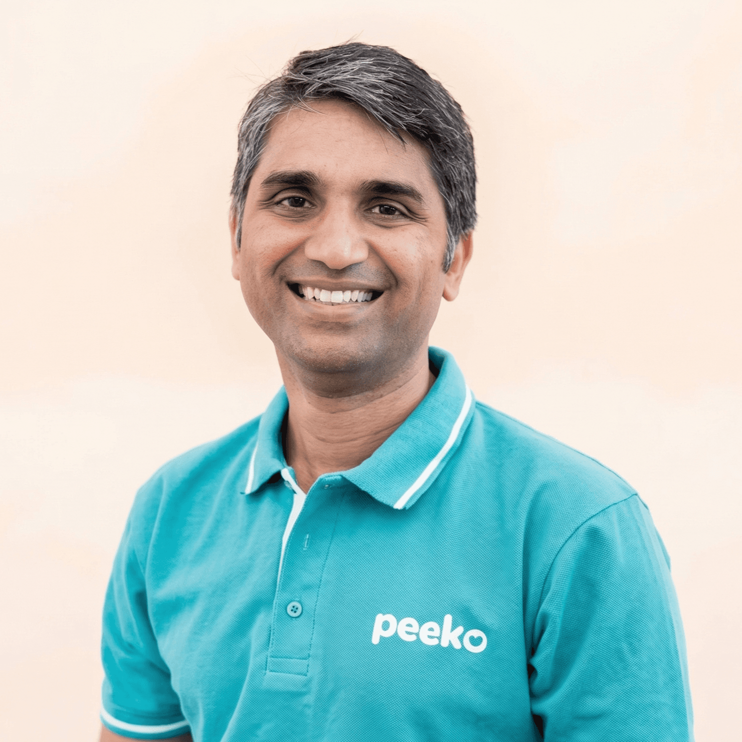 man in gray suit jacket and black pants standing on brown concrete pathway during daytime