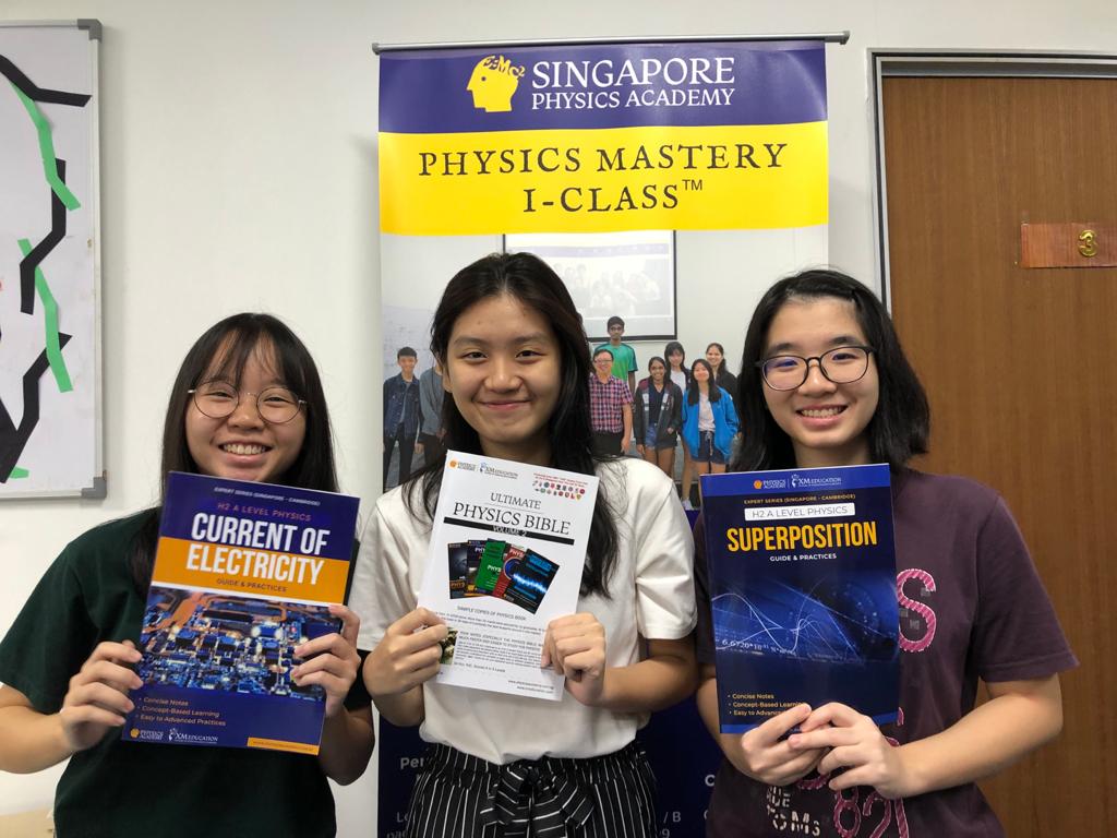 Students at Physics Academy with their Physics Compendium Book