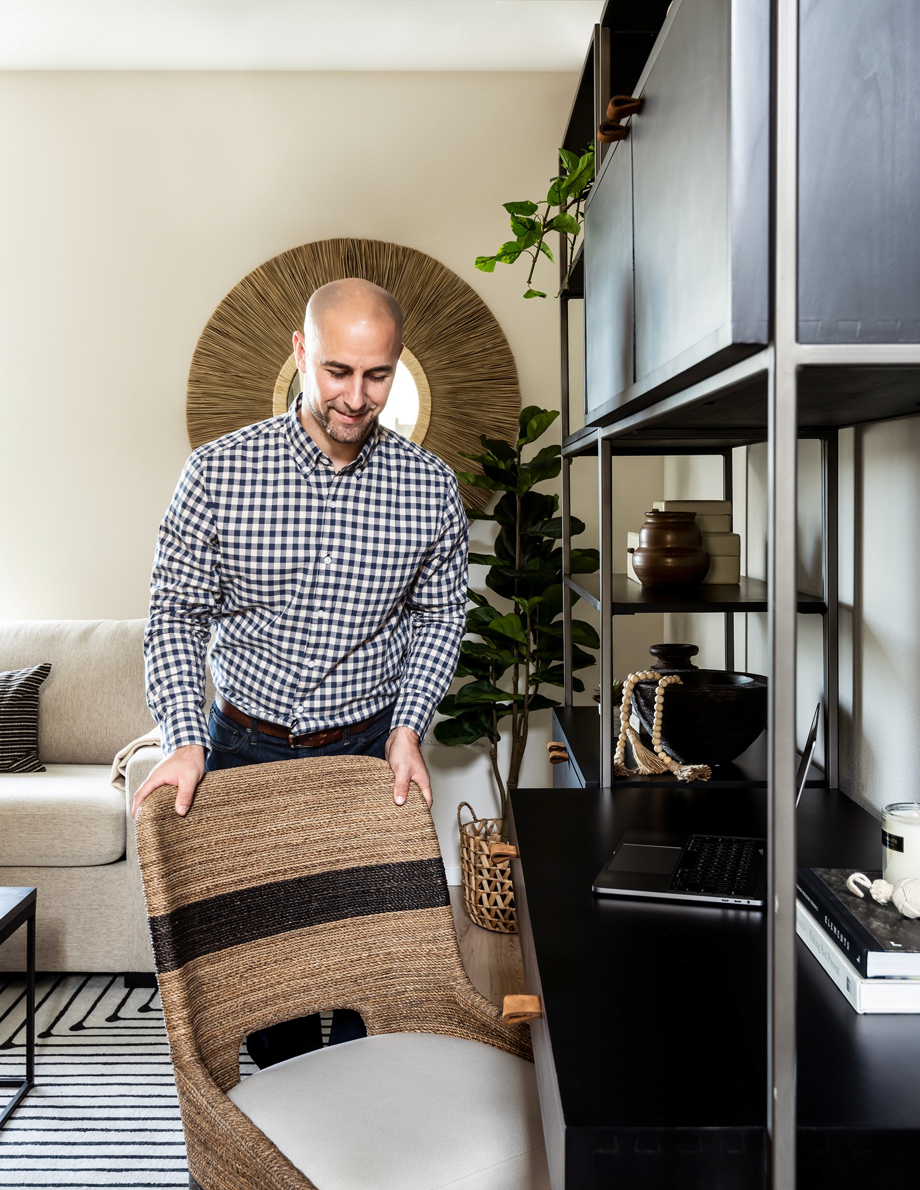John Monte arranges bar stools in this Leschi Walkup home in Seattle WA by Elegant Simplicity Interior Design firm in Bellevue, WA
