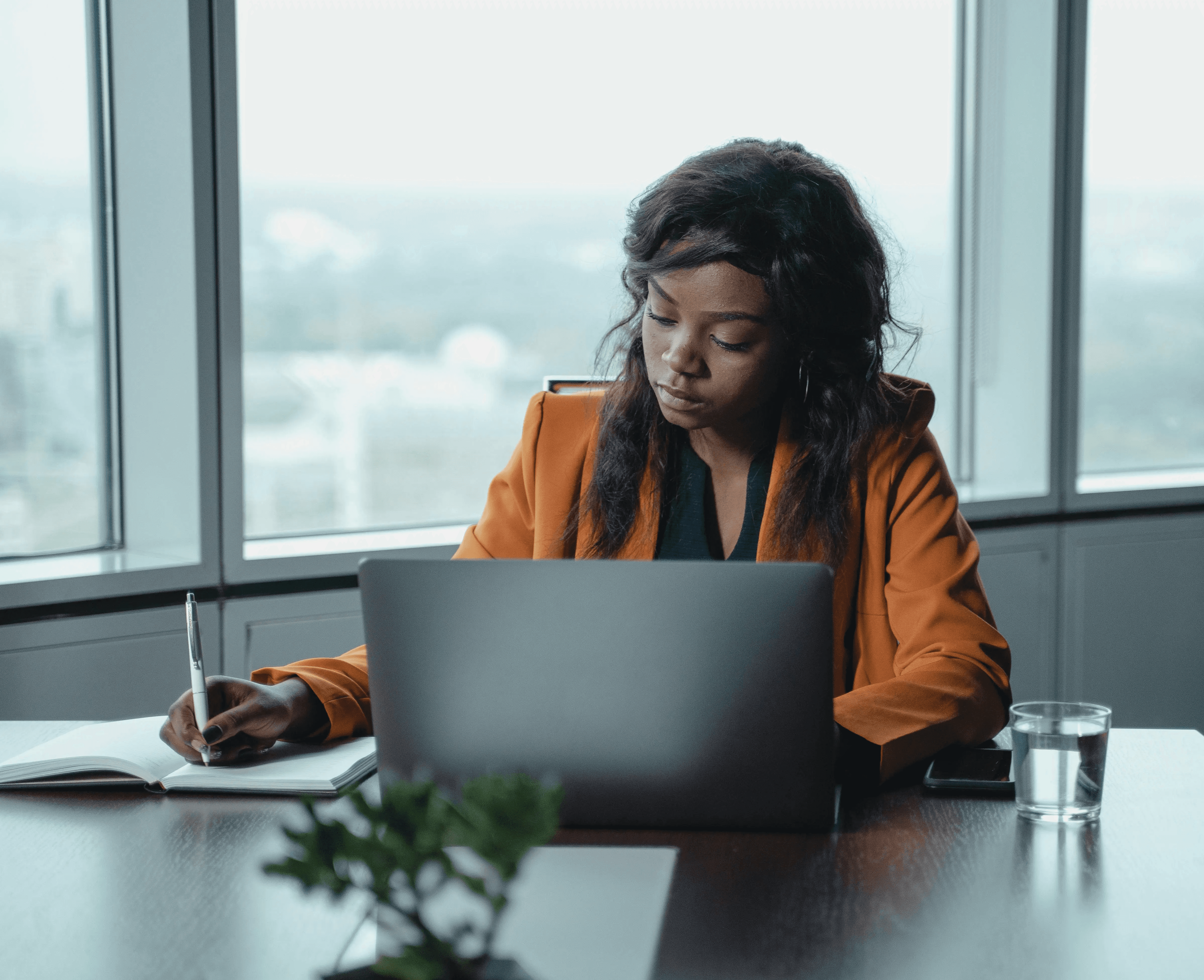 Expat professional tracking job search applications in notebook and laptop in Germany