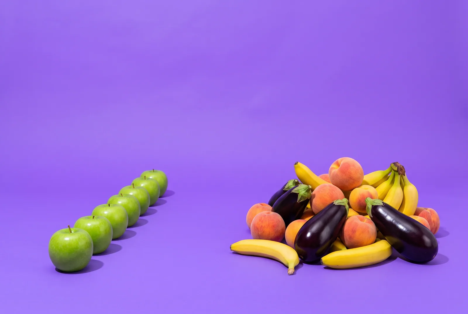 A neat row of green apples beside a chaotic pile of peaches, bananas and eggplants, Following versus For You on X