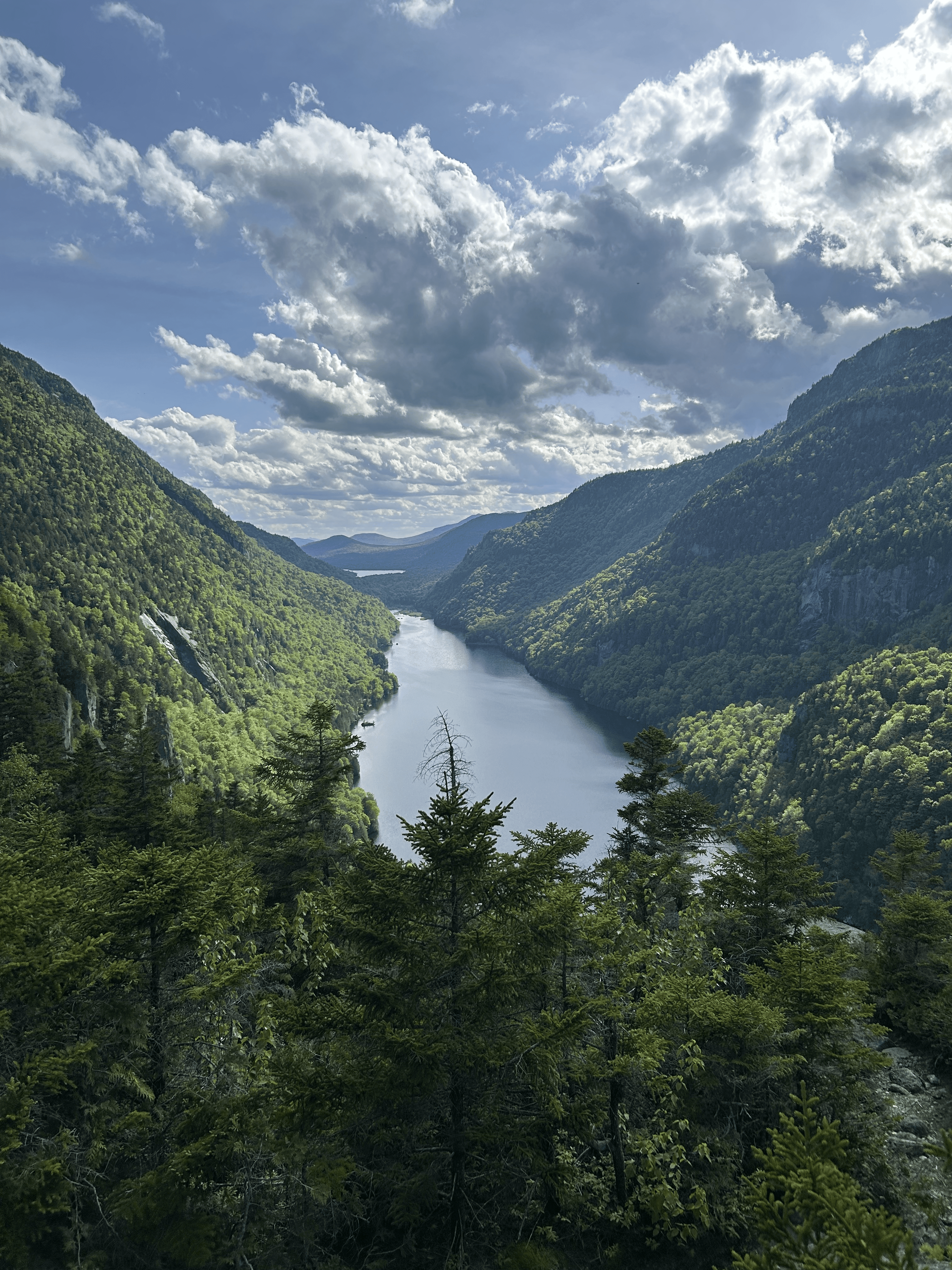 man filming on beach