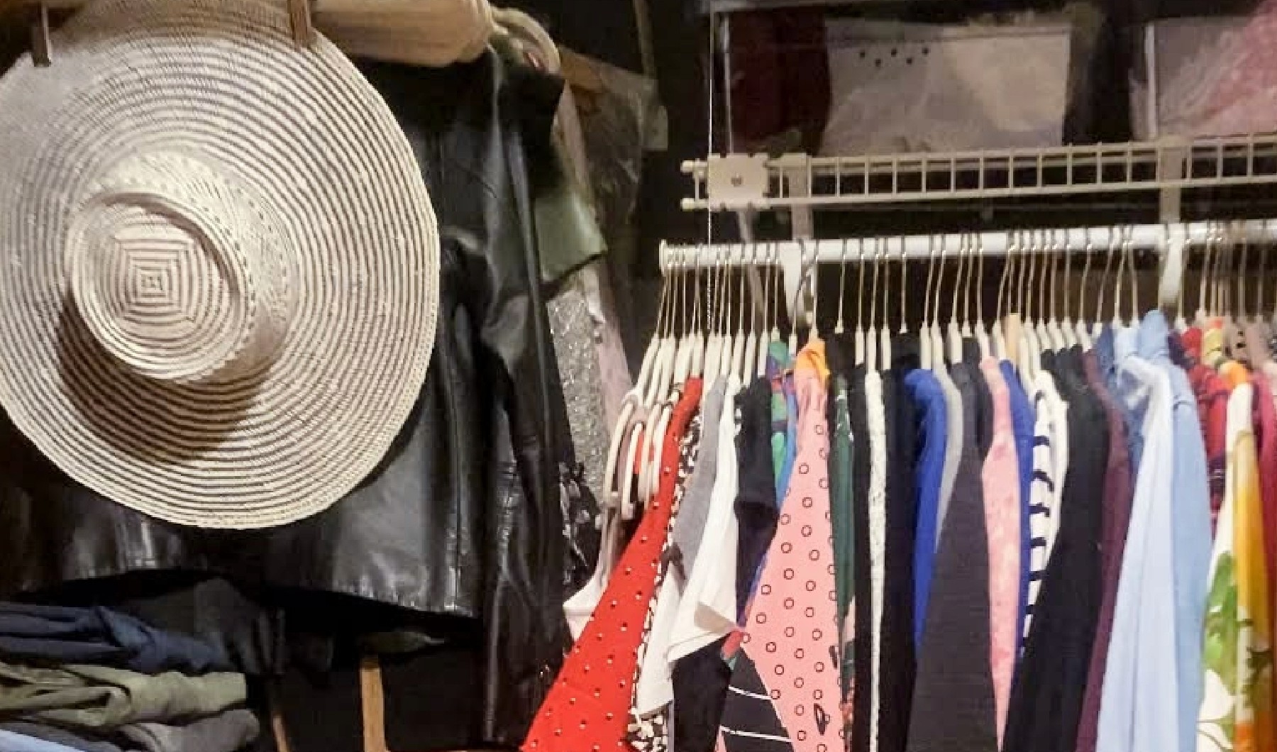 organized closet with hat and lots of clothes