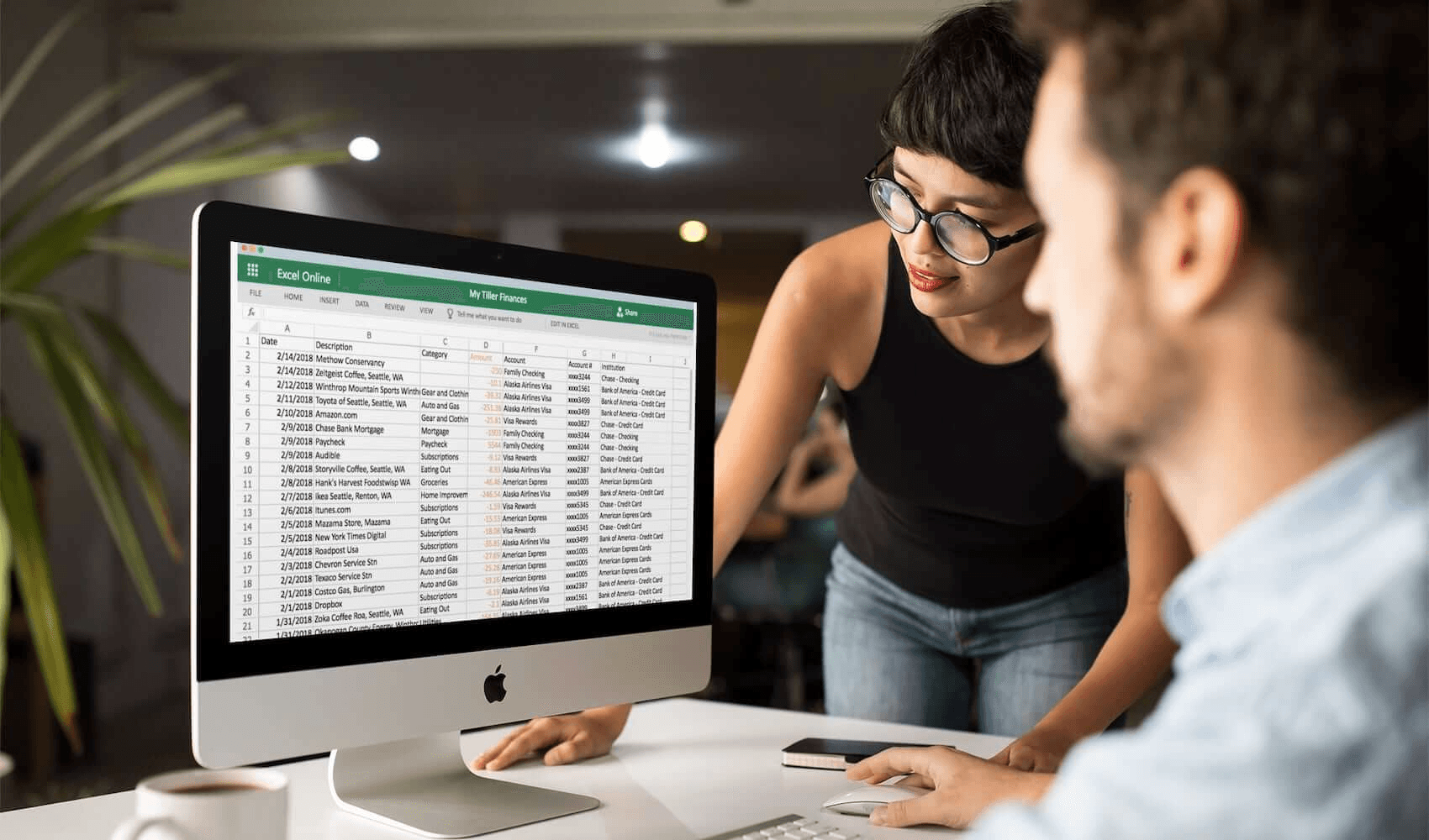 People reviewing Excel spreadsheet - Excel Data Organization Best Practices