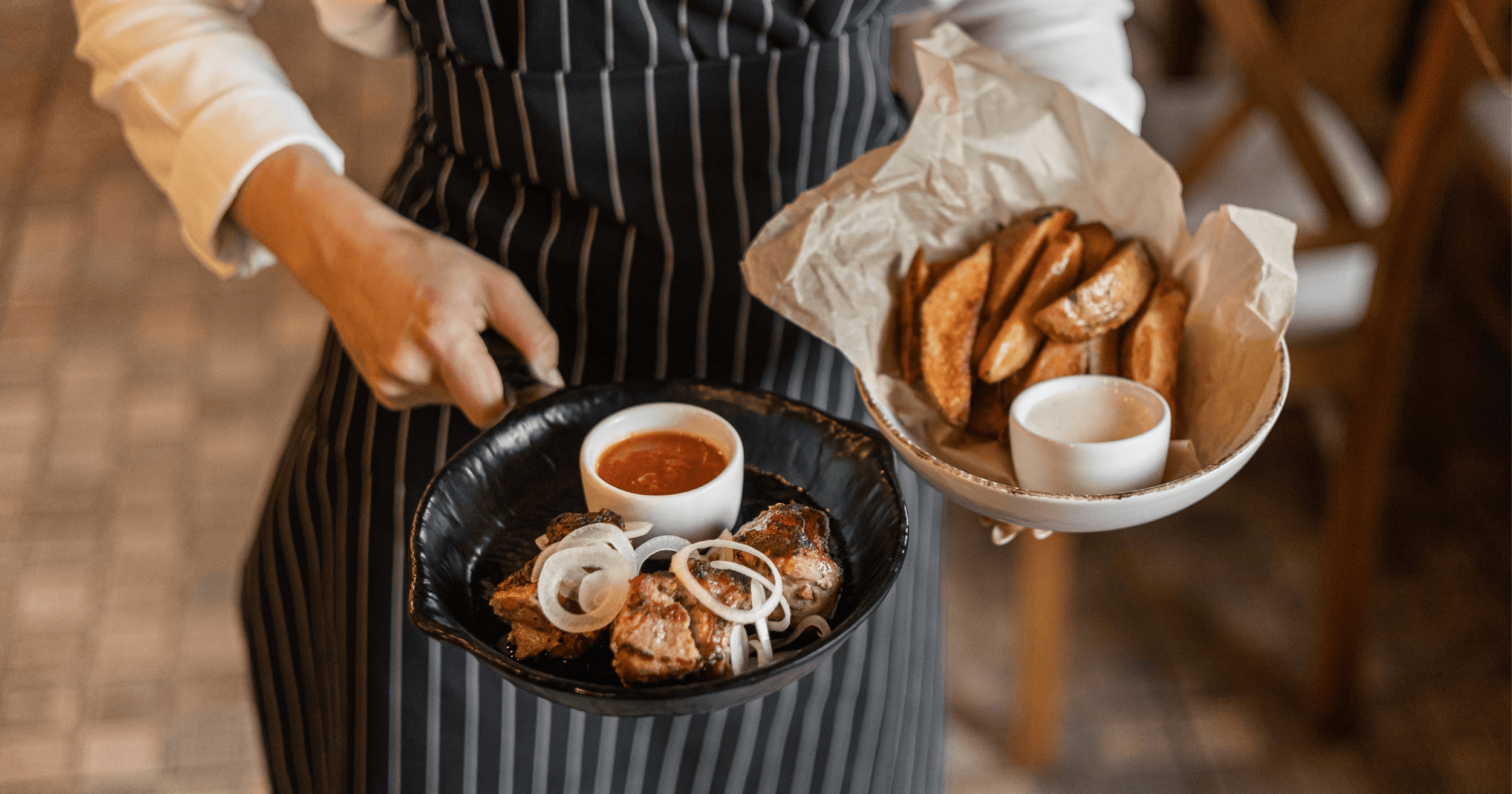 Waiter bringing an order to the customer's table