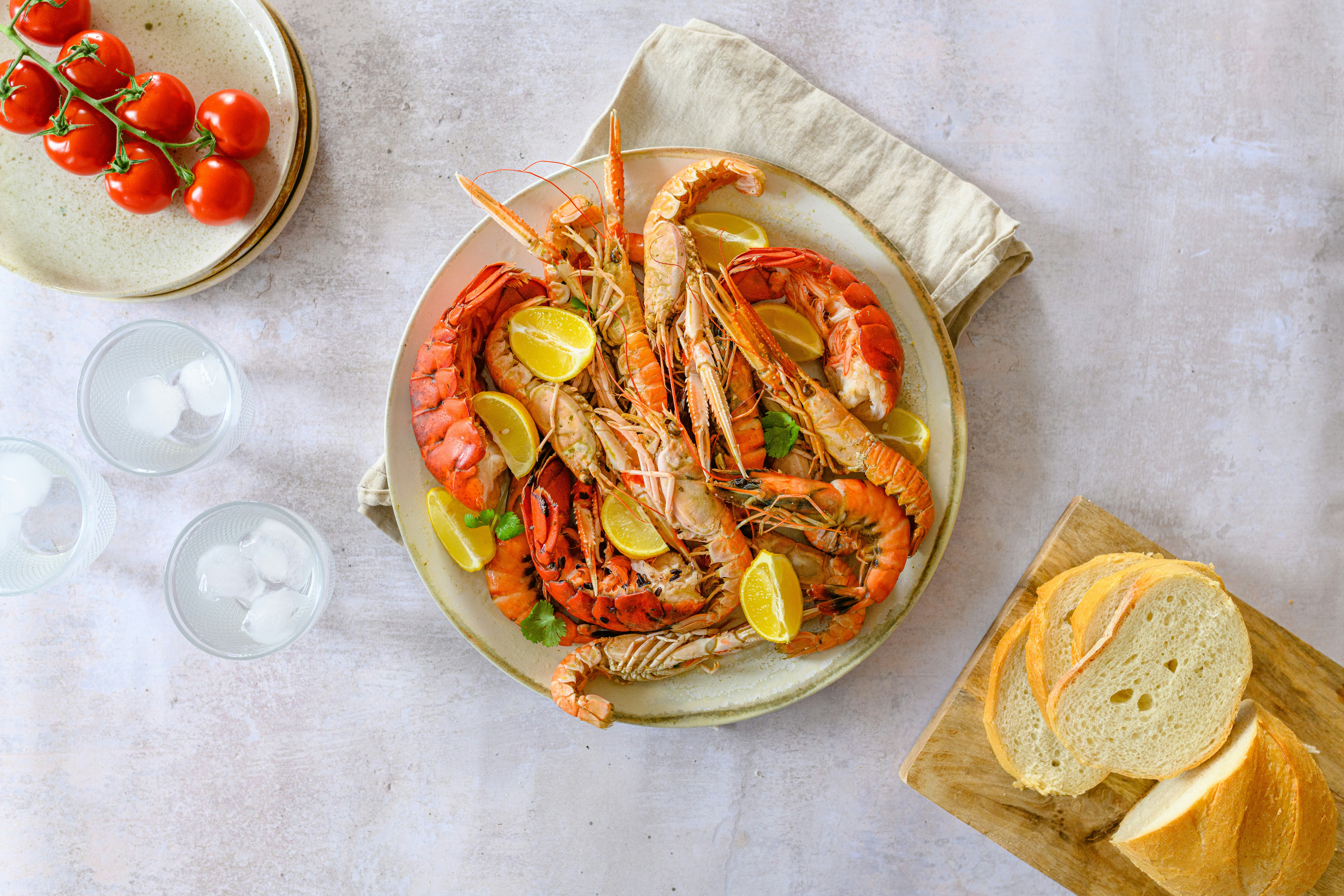 Fresh seafood platter served with lobster tails, shrimp, and lemon slices.