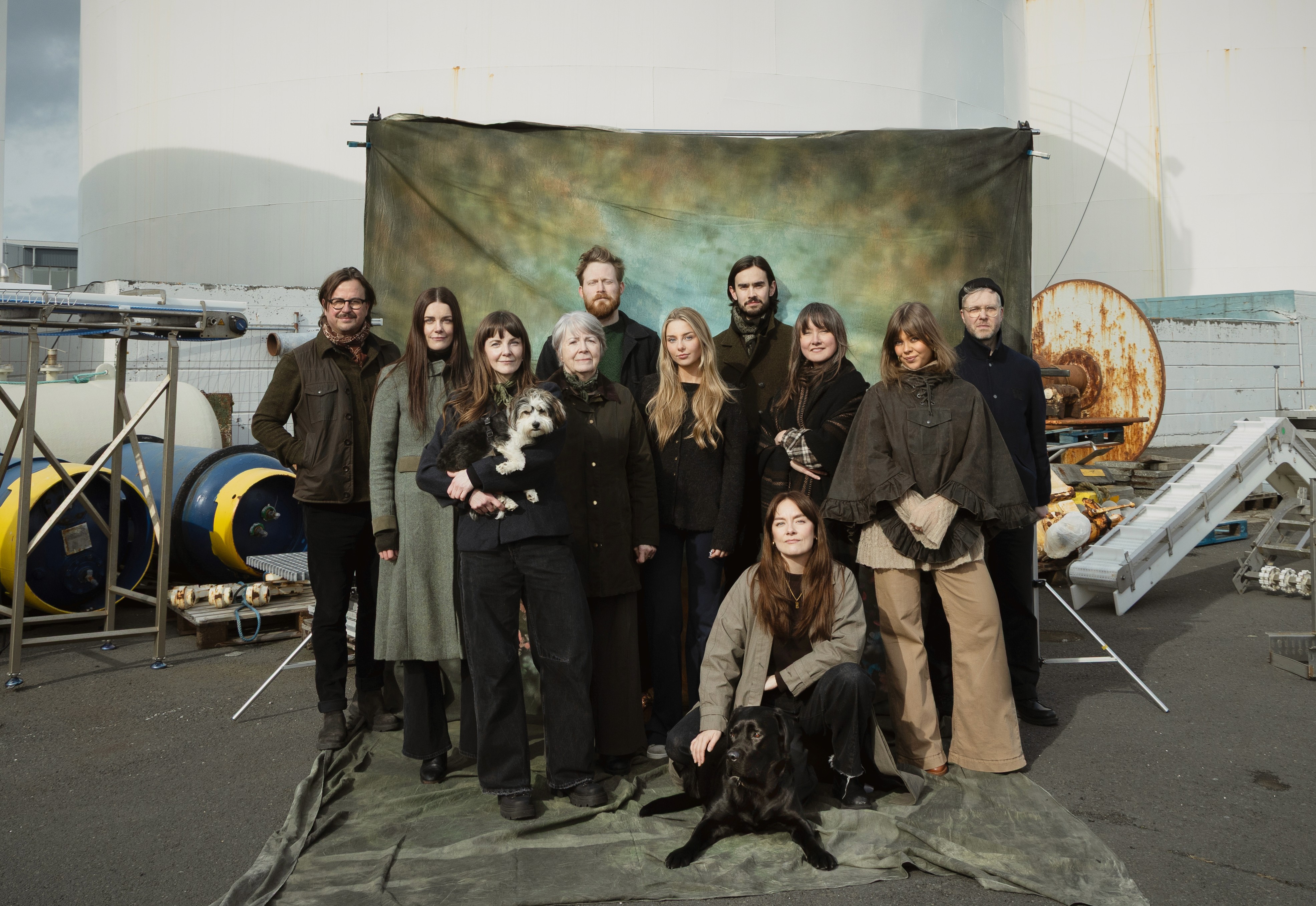 Vibrant green Northern Lights dancing over a tiered waterfall in Iceland at night. Photo by Witness.