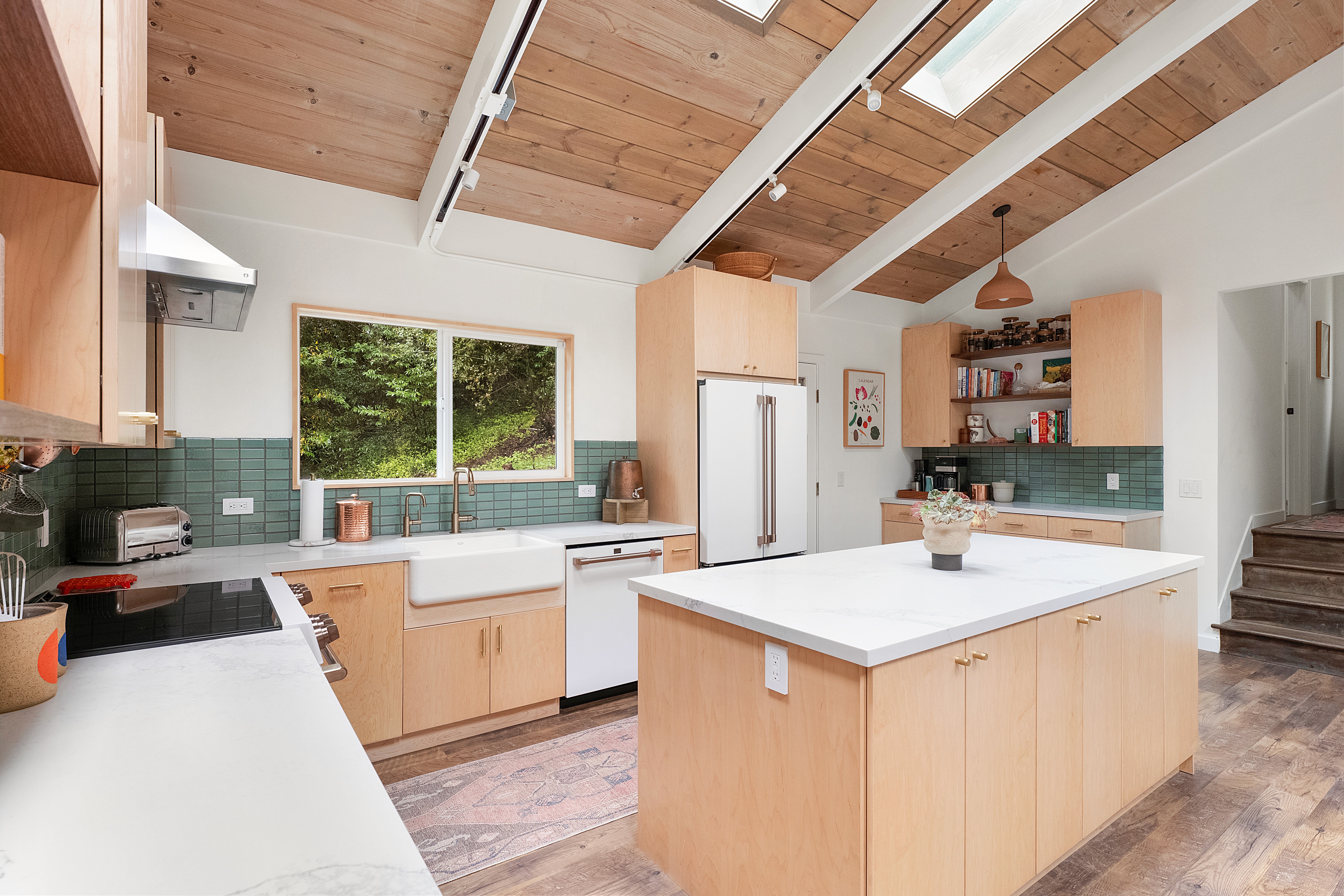 “Minimal shower remodel with white tile walls, rain shower head, and floating wood shelves”