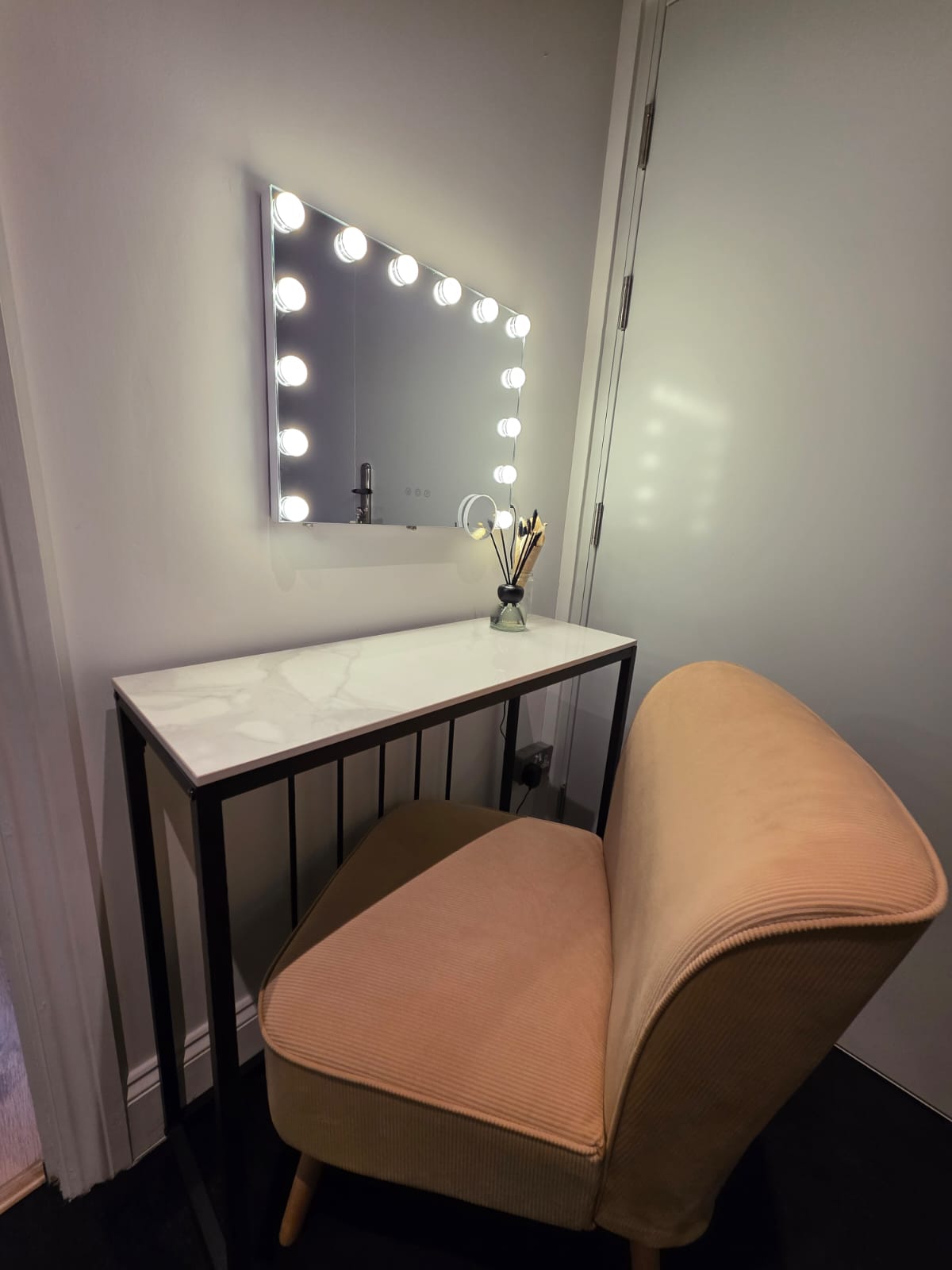 a black and white photo of a man in a sweater