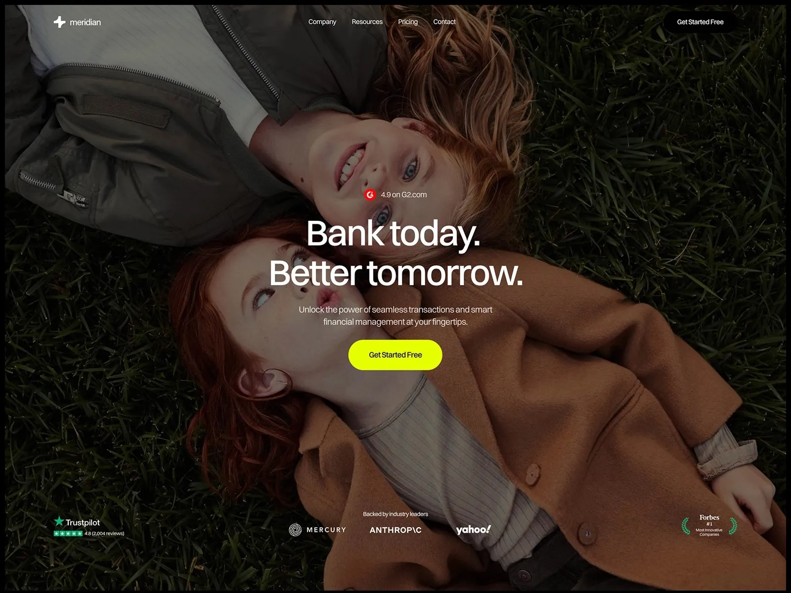 Two people lying on grass with a call to action button for banking services.