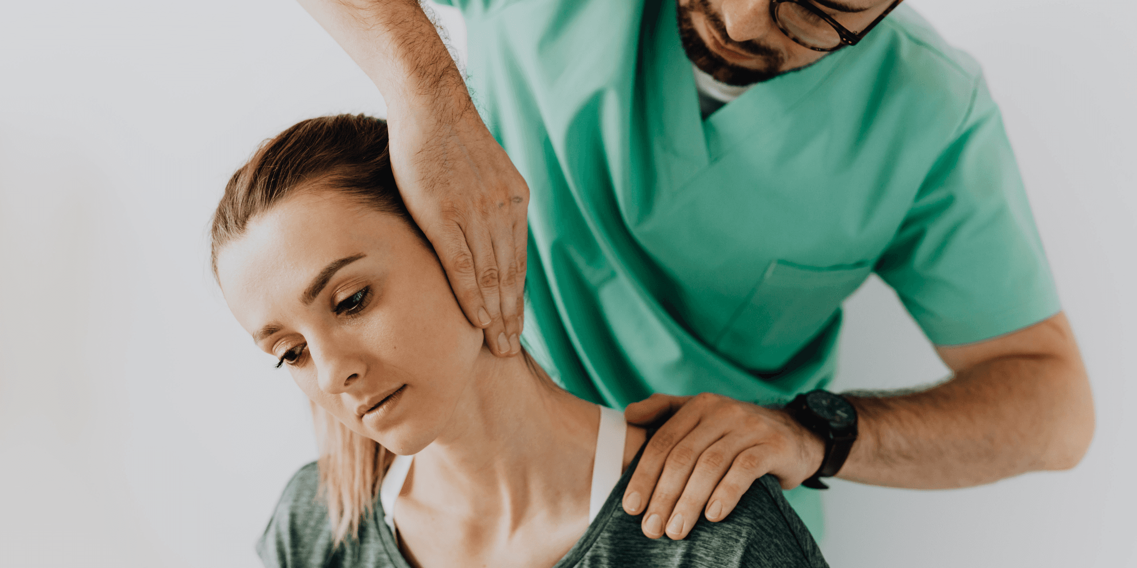man wearing gray polo shirt beside dry-erase board