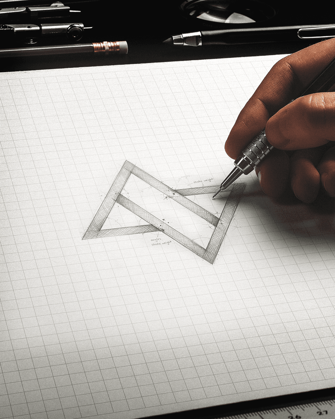 Woman in red outfit poses by a red telephone booth.