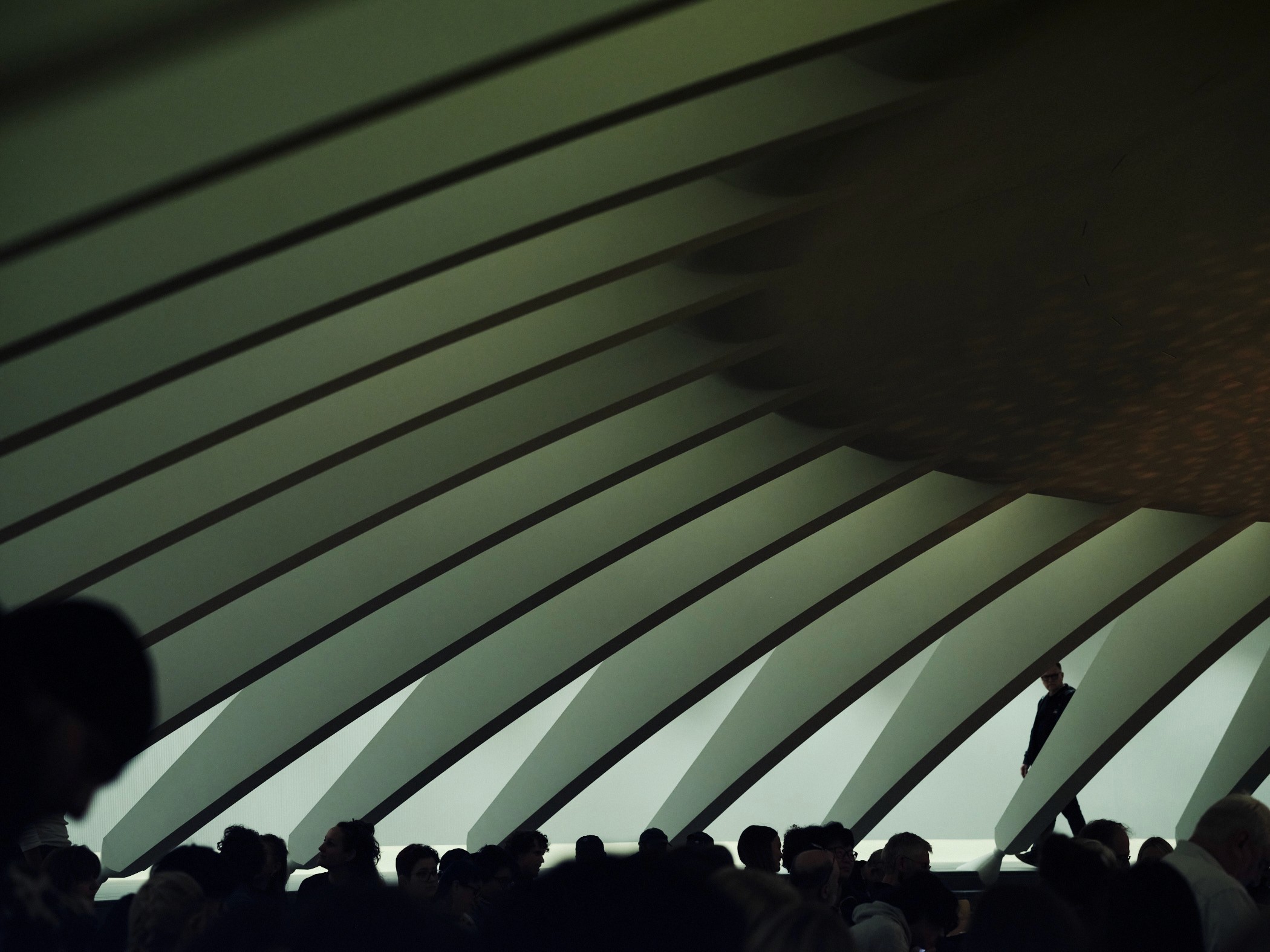 aesthetic blue photo of a blonde woman in black clothes