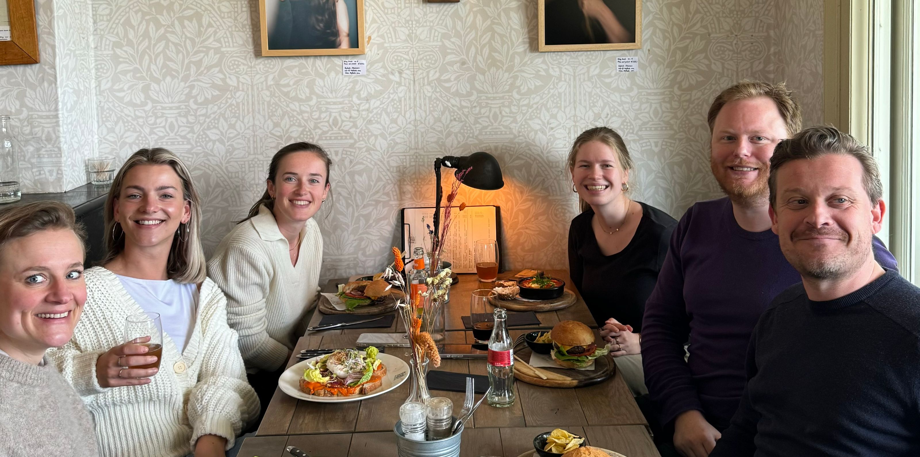 Caro team enjoying a meal in a restaurant together