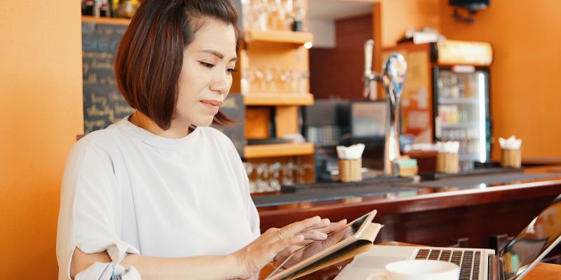 A F&B business owner looking at data to increase restaurant sales