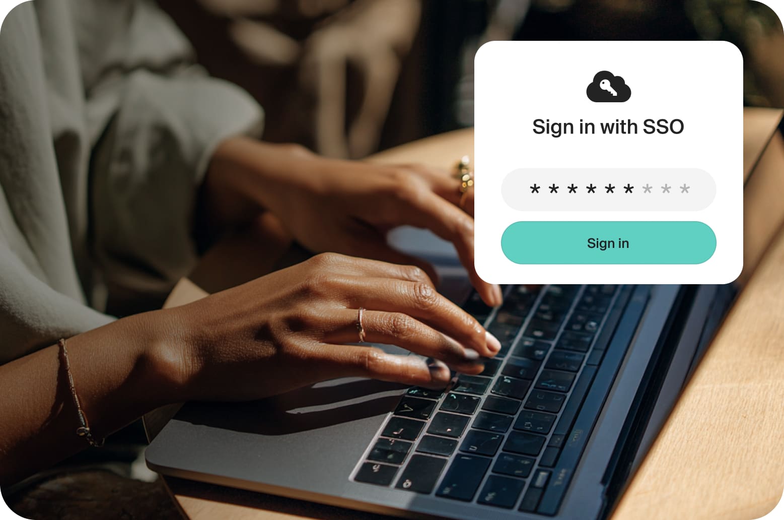 Close up shot of a woman typing on a laptop keybpoard.
