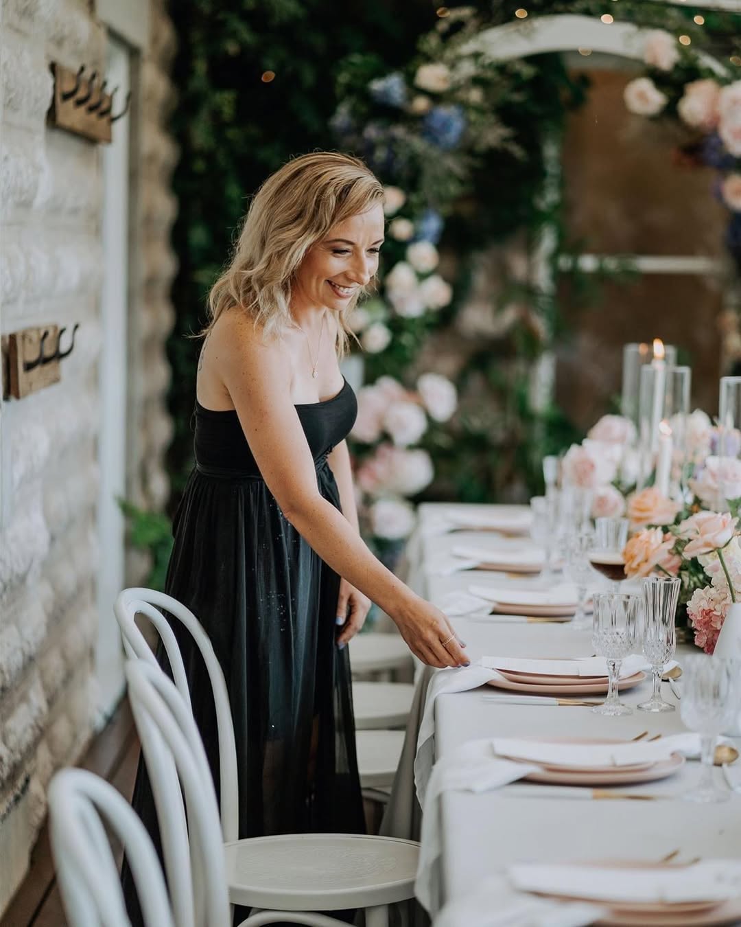 Ammie Watts putting finishing touches on a table setting