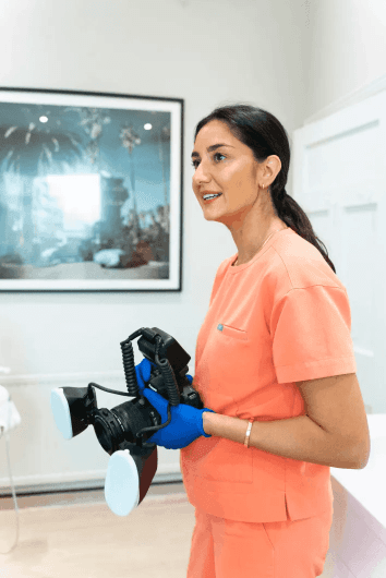 a man getting his teeth checked by a dentist
