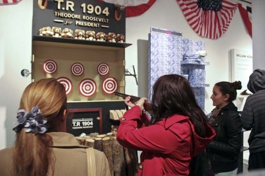 Woman shooting a target with a weapon