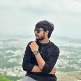 Profile portrait of a man in a grey shirt