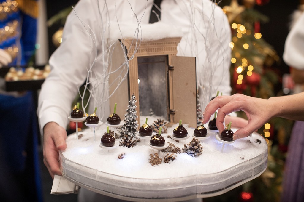 Children receiving Nutcracker-themed gifts