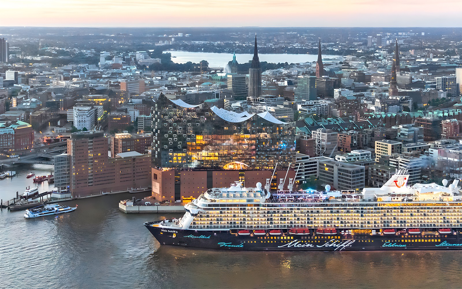 Aerial view of Elbphilharmonie and cruise ship in Hamburg, Germany at sunset.