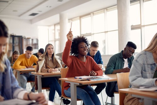 Classroom with student raising hand