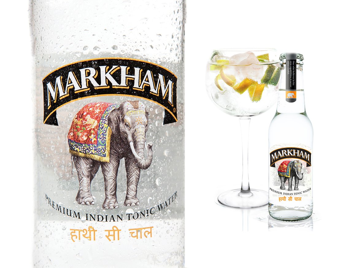 Rooftops of a coastal town with the sea in background