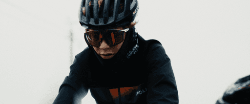 a woman holding a red flower