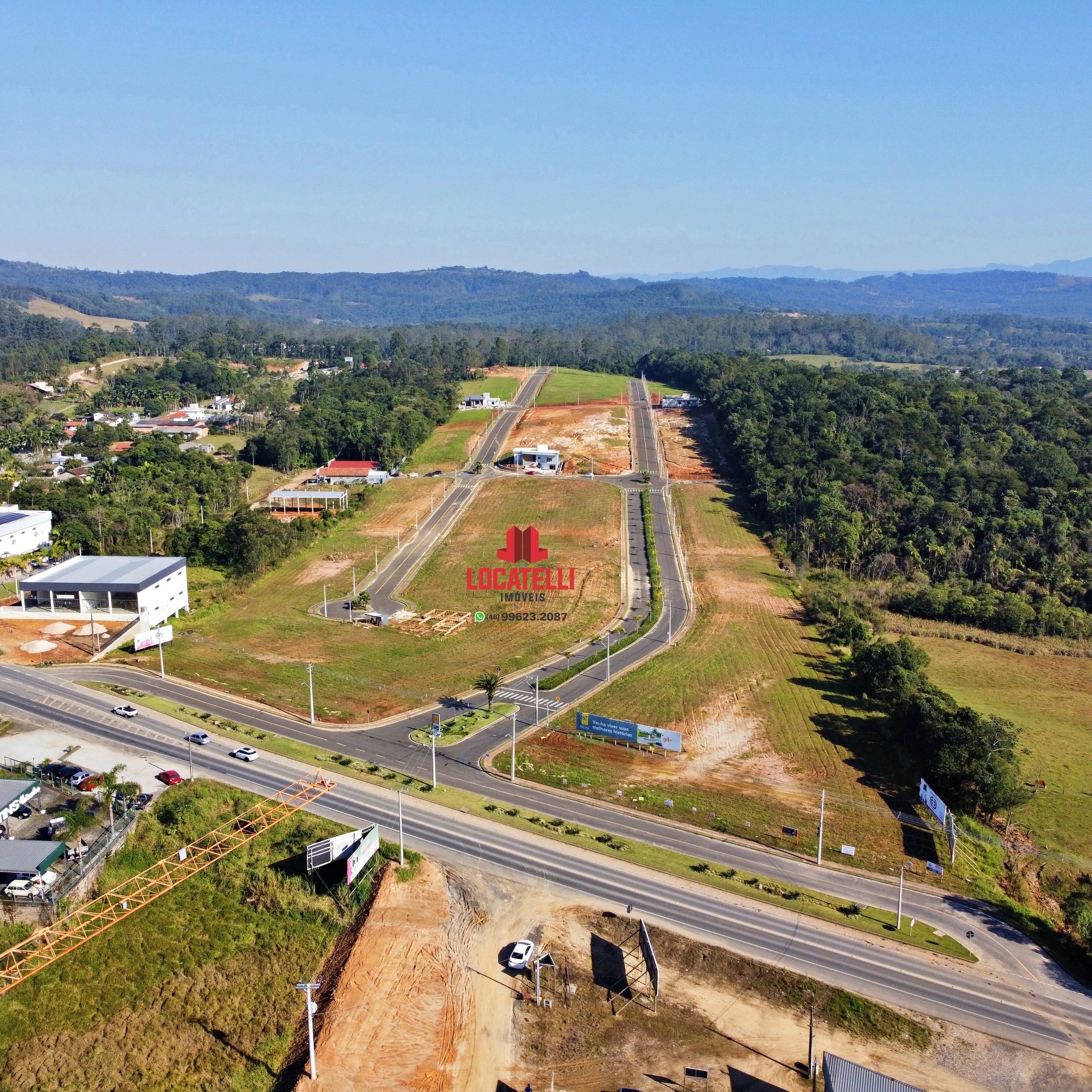 A modern brick house with a two-car garage, well-manicured lawn, and clear blue sky in the background.