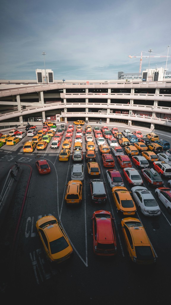 A crowded multi-level parking lot filled with cars, illustrating the importance of dynamic pricing strategies for optimizing parking revenues.