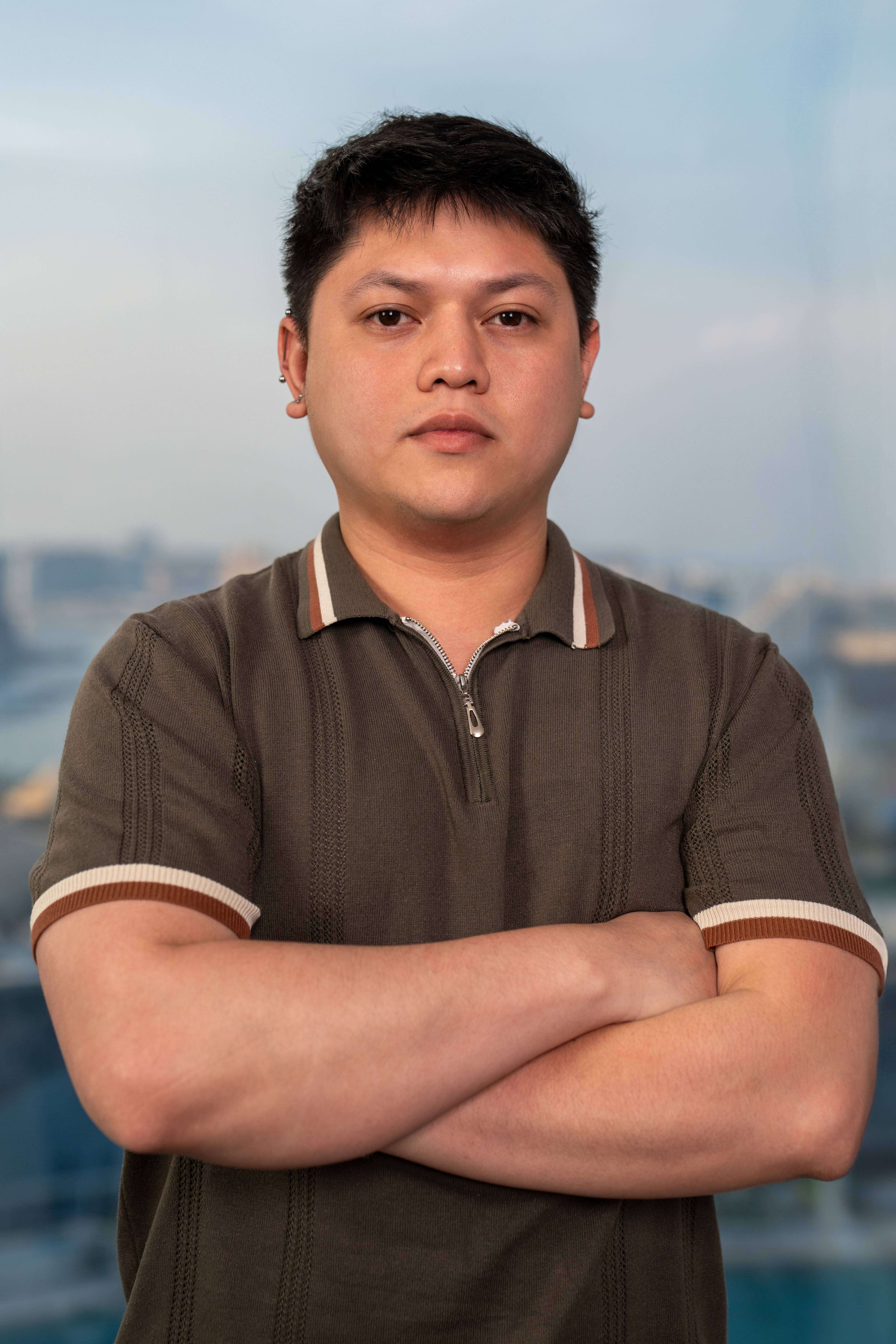 a man standing in front of a red light