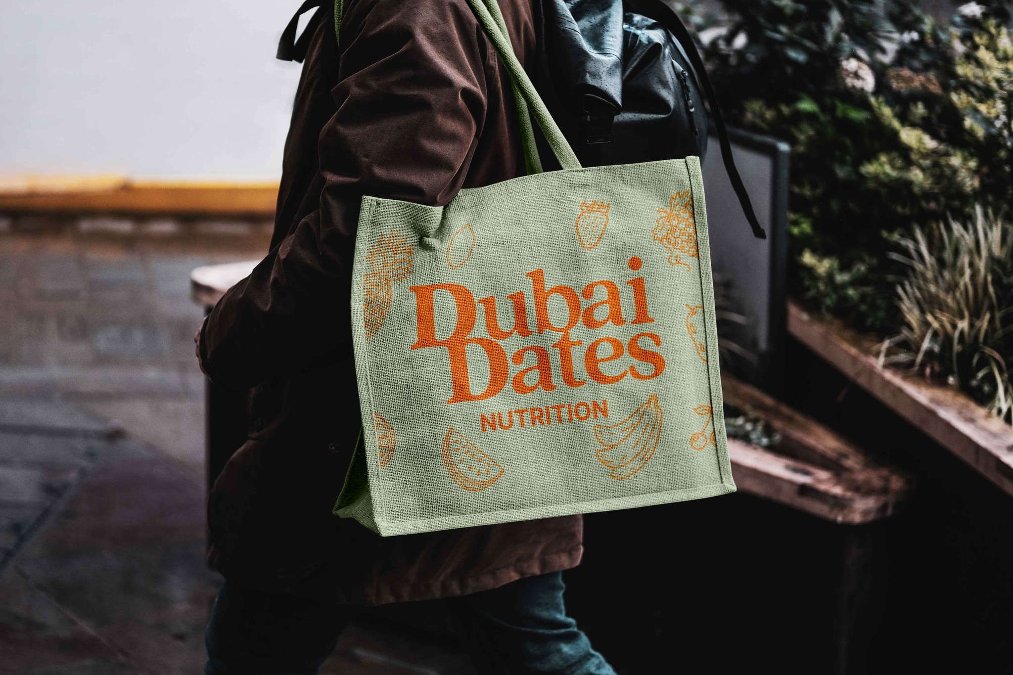 Tote Bag with Dubai Dates Nutrition logo in orange on a green background.