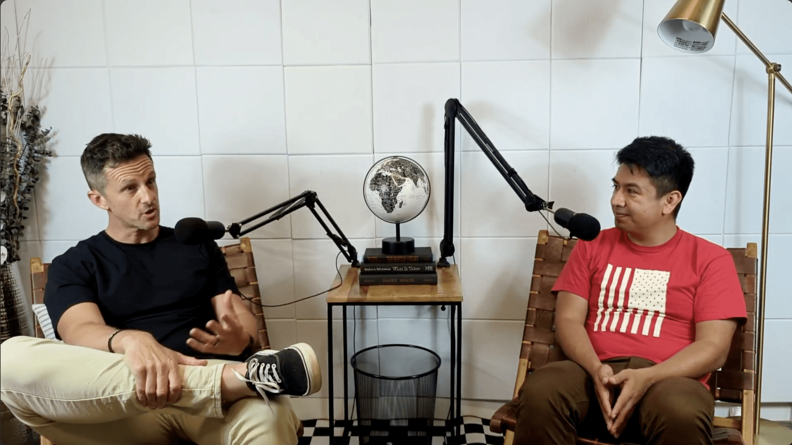 a group of children sitting on steps in front of a building