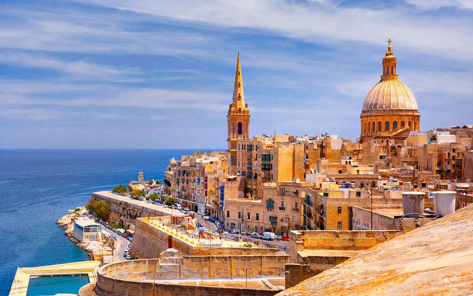 Valletta skyline with St. Paul's Cathedral and the Mediterranean Sea, Malta.