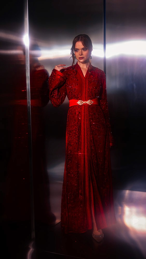 Crimson Moroccan caftan with rich handcrafted detailing, luxury evening wear designed for Bahrain and Gulf clients