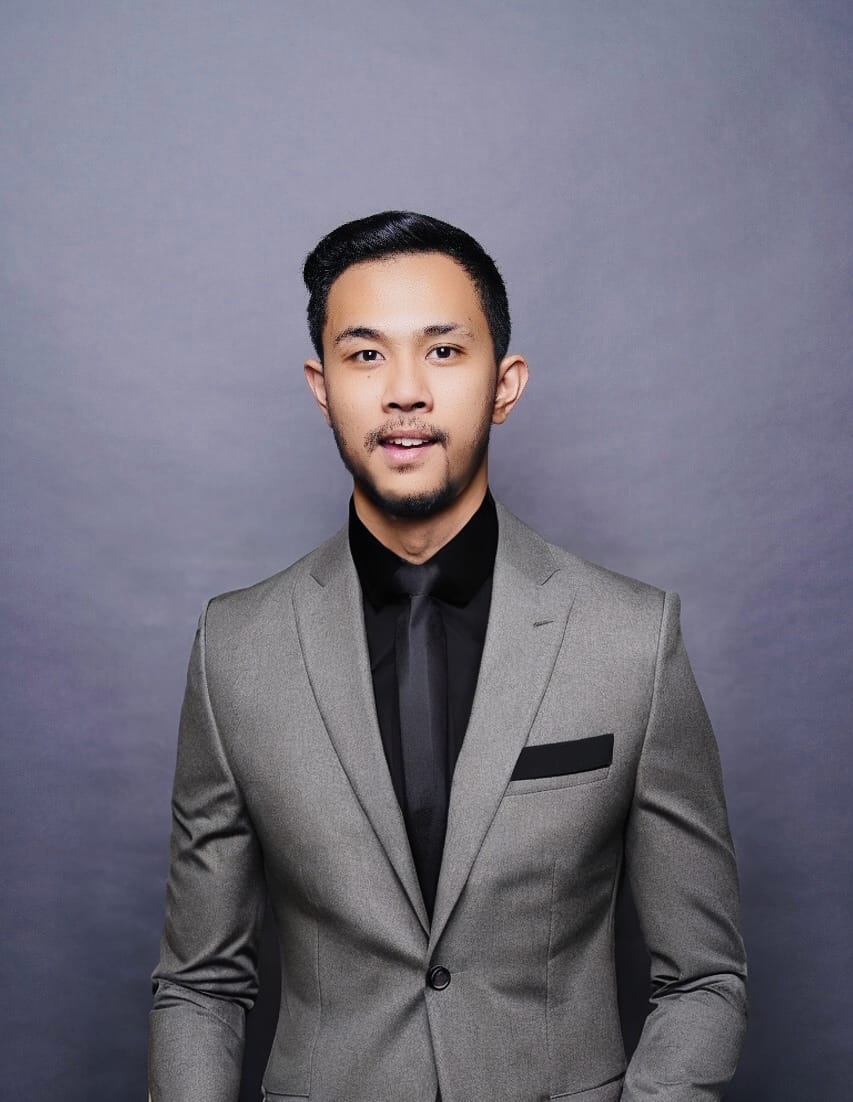 Professional man in black shirt smiling